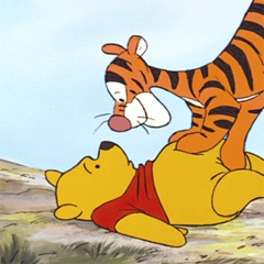 Tigger pounces on his good friend Pooh